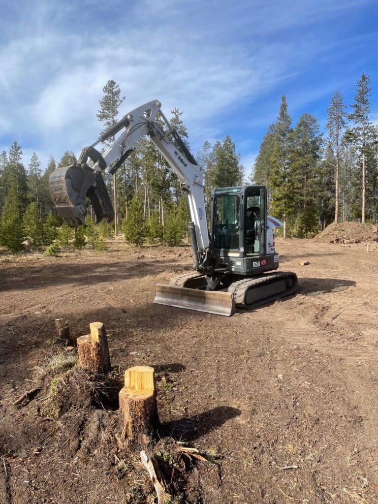 Pulling stumps to help prepare for a home site.